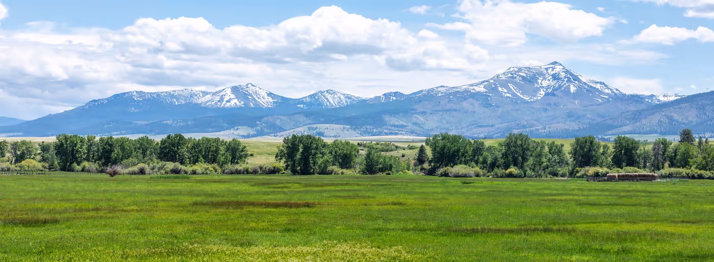 Wide green valley under summer cloud near John Day, Oregon — Aaron Cherry, REALTOR in Roseburg, Oregon