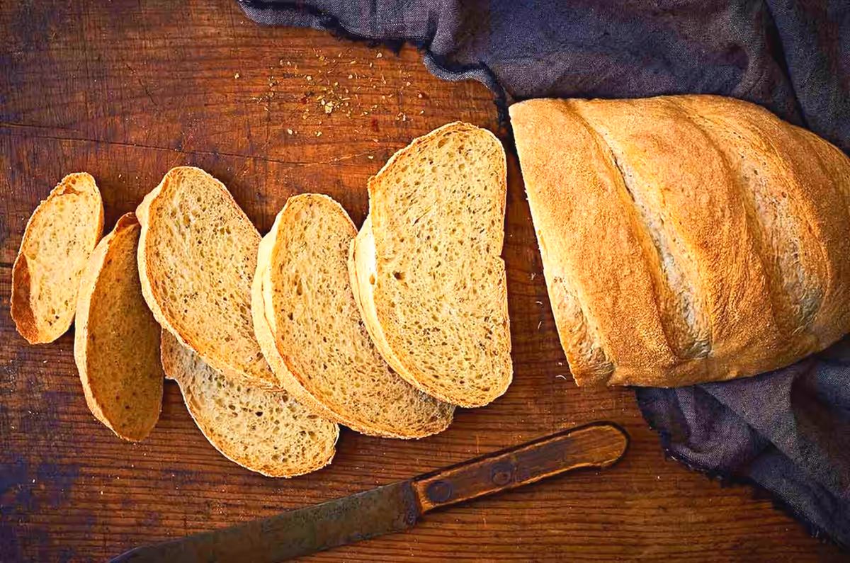 A sliced loaf of bread on a wooden board — Aaron Cherry, REALTOR in Roseburg, Oregon